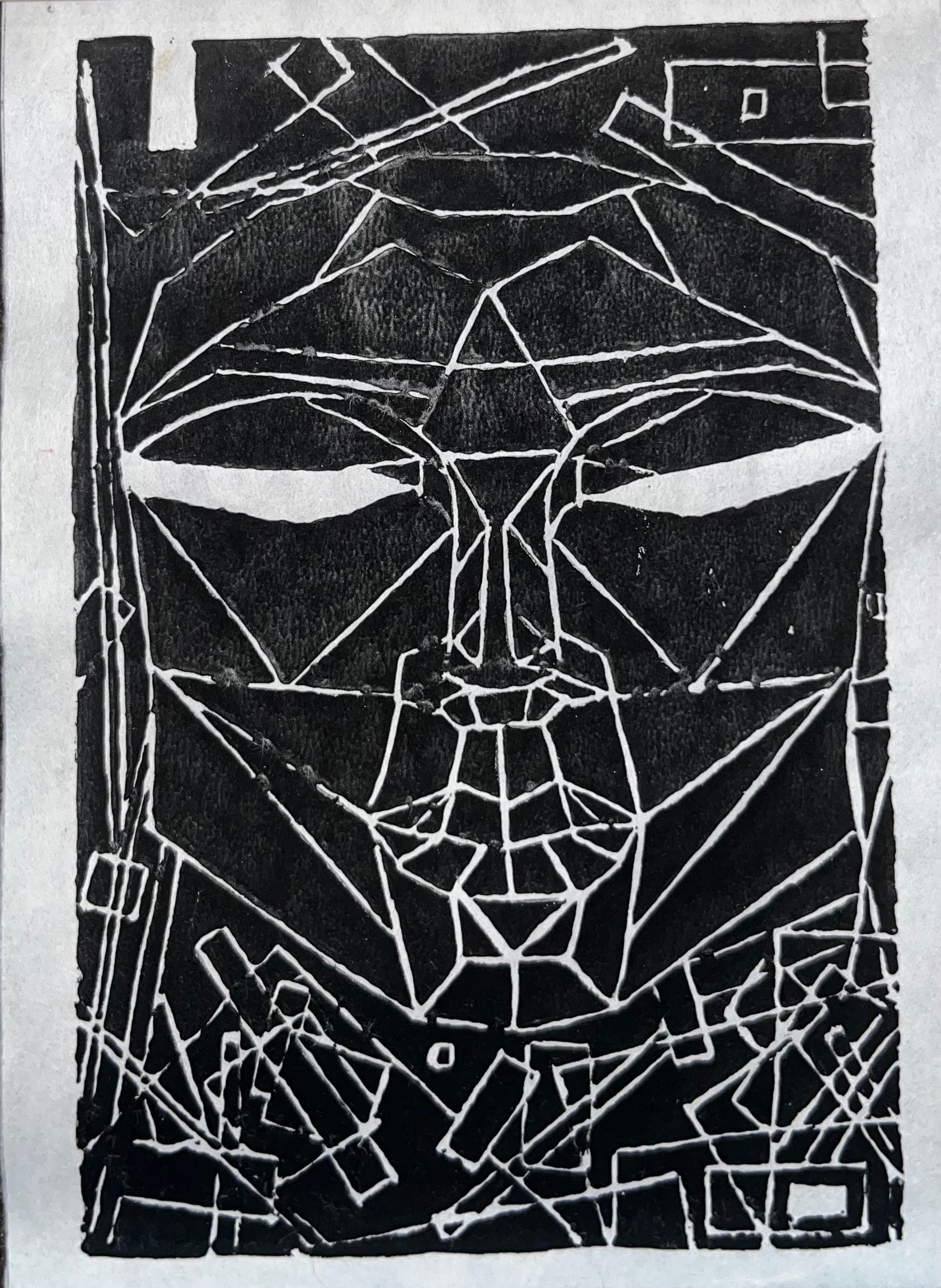 Black linocut geometric face — original artwork by Kristy Long